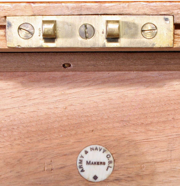 It is less common to find English trunks made of camphor wood although the repellent qualities in protecting the contents were well known. This camphor trunk bears a round label to the inside of the lid noting the maker as the Army and Navy CSL. The