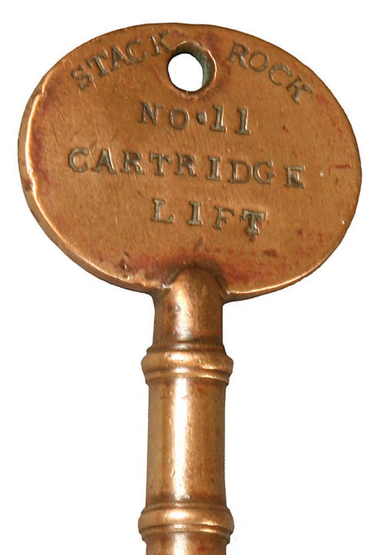 This bronze key is from Stack Rock Fort off the Pembrokeshire coast at Milford Haven. The key is stamped to one side Stack Rock, No. 11 Cartridge Lift with W.D. for War Department and a broad arrow mark to the other. It was first proposed to build a