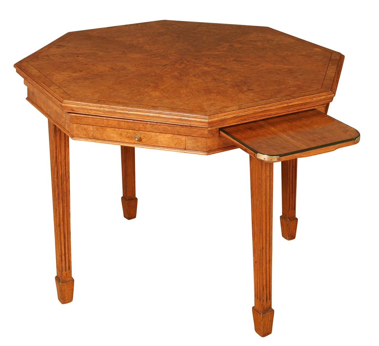 When the pollard oak cover of this centre table is removed, the blue baize top and its secondary use as a games table is revealed. It is stamped to the underside and the tops of the 2 drawers with the maker’s name of Trollope & Colls, along with