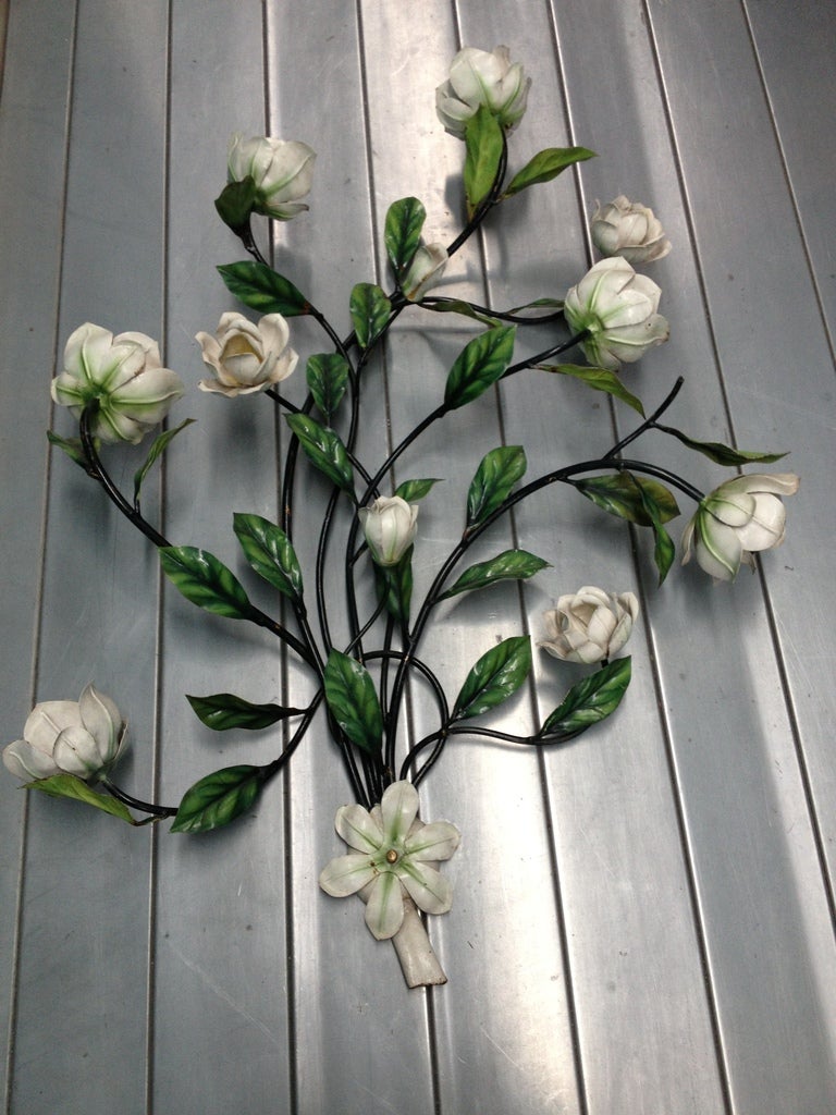 A 1950s large tole wall fixture with lighted magnolia blossoms. Wiring is original. Bulbs are hidden inside magnolia blossoms. 6 Presently wired to take 6 night-light size bulbs.
