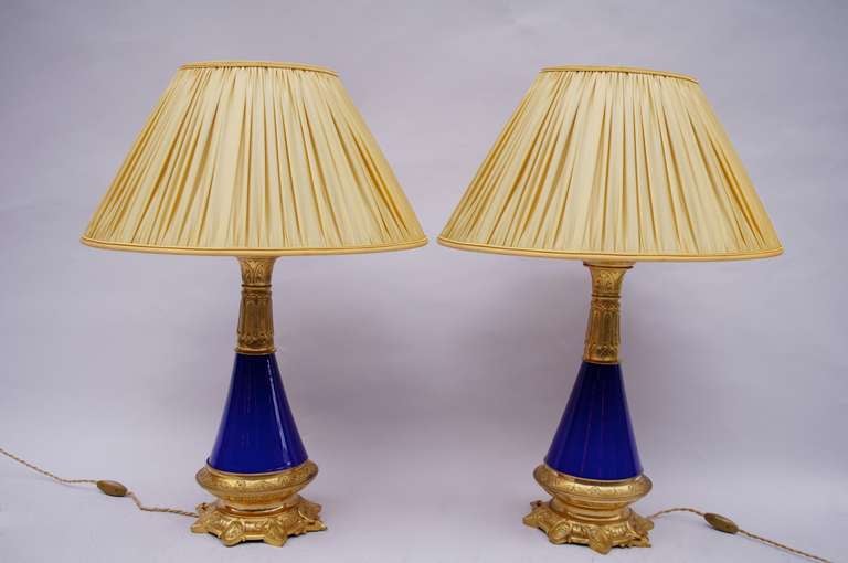 Pair of conical blue porcelain lamps and gilt bronze mount, 1900 period