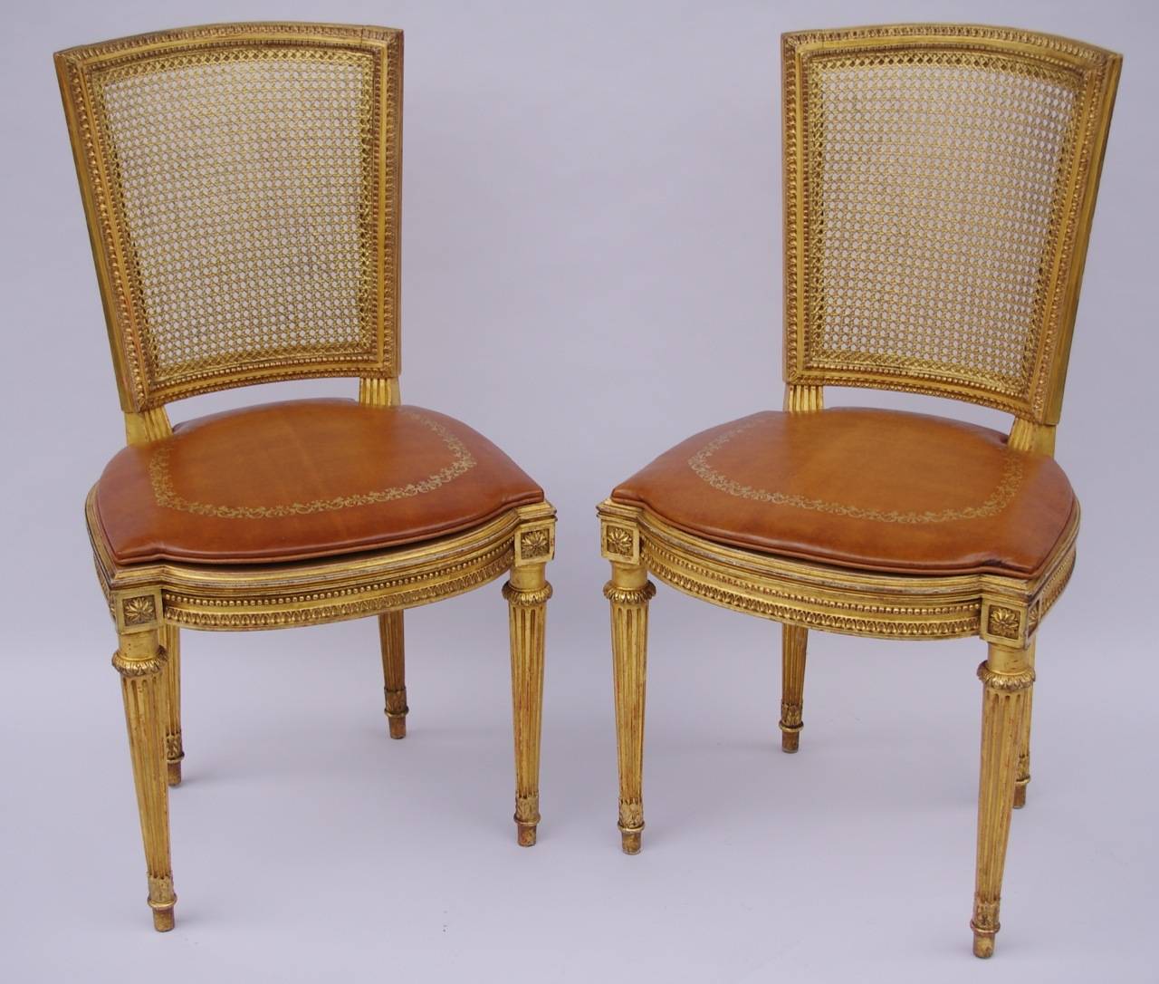 Late 19th Century Pair of Louis XVI Style Gilt Carved Cane Armchairs, circa 1880