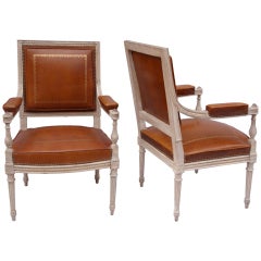 Pair of late 19th century leather covered Louis XVI style armchairs