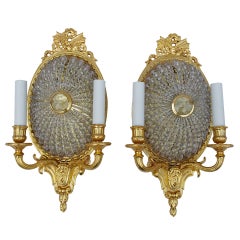 Pair of oval Louis XVI style glass and gilt bronze wall sconces, 1900 period