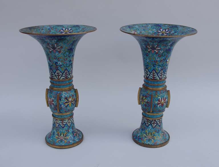 . Cloisonné enamel 
. Bronze
. End of XVIIIth century - Early XIXth century 
. Gu-shaped 
. Flaring neck vases