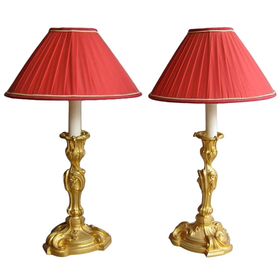 Pair of gilt bronze Rocaille style candlesticks, circa 1940 For Sale