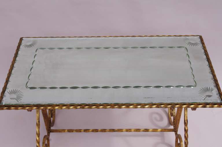 French Gilt wrought iron coffee table with glass top, circa 1950