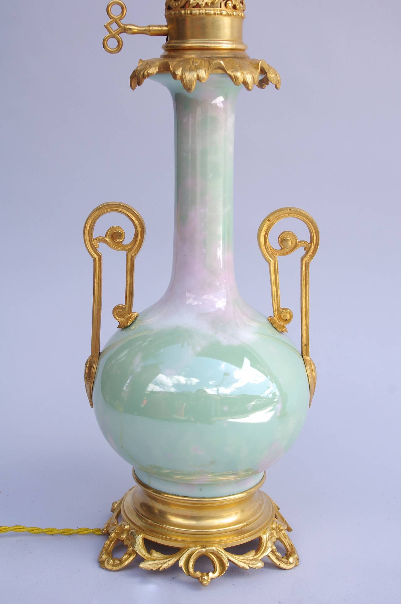 Napoleon III Pair of Iridescent Celadon Porcelain Lamps, circa 1880 For Sale