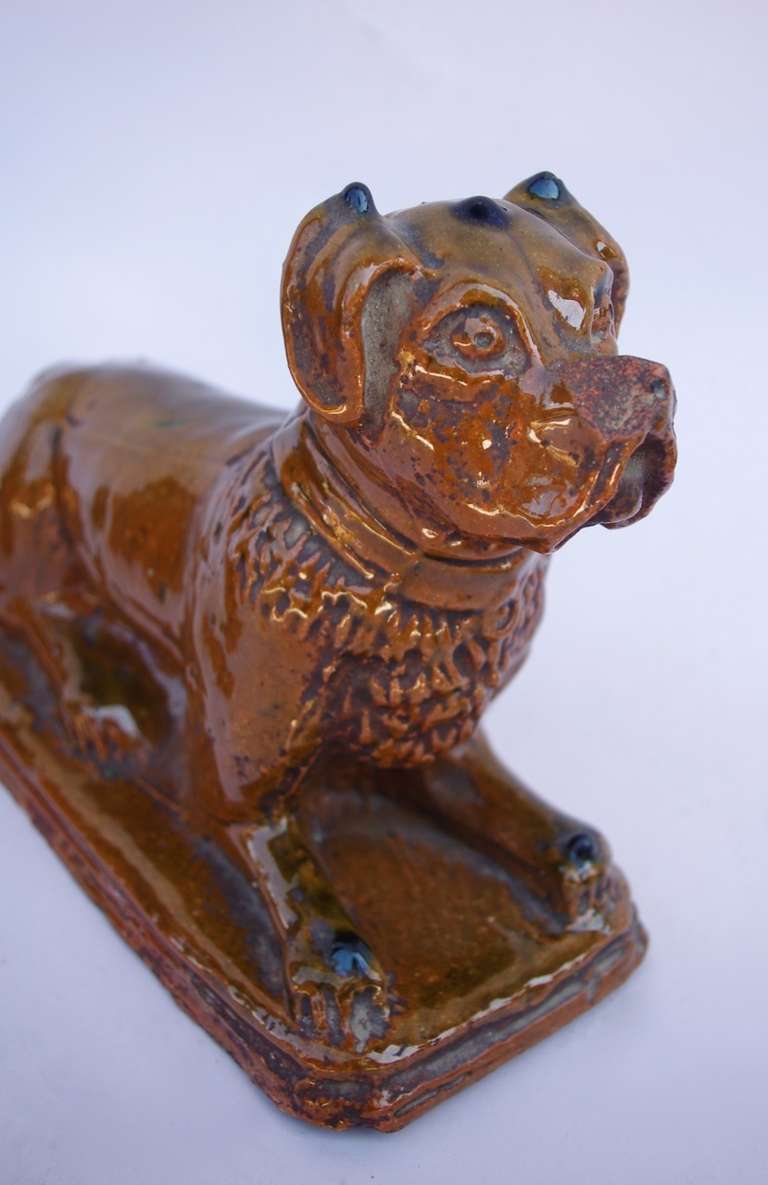 French Pair of tawny enameled earthenware boxer dogs, circa 1900 For Sale