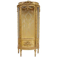 19th c. Louis XVI style showcase in gilded and sculpted wood