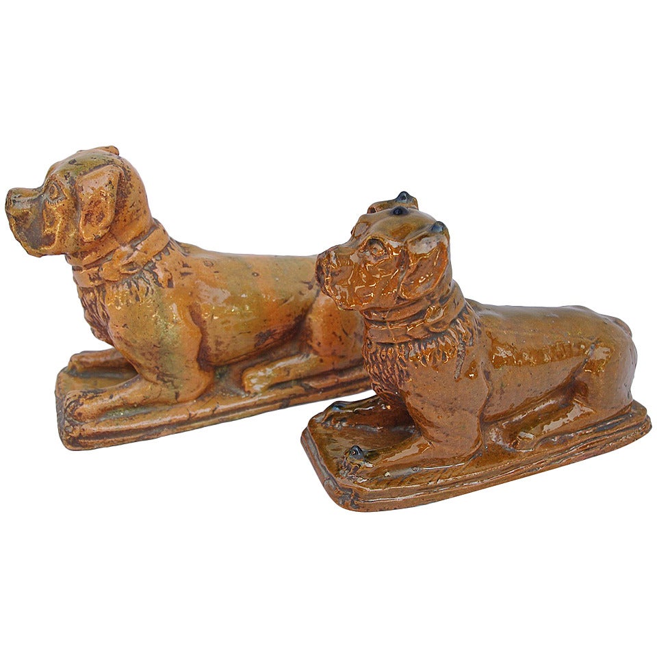 Pair of tawny enameled earthenware boxer dogs, circa 1900 For Sale