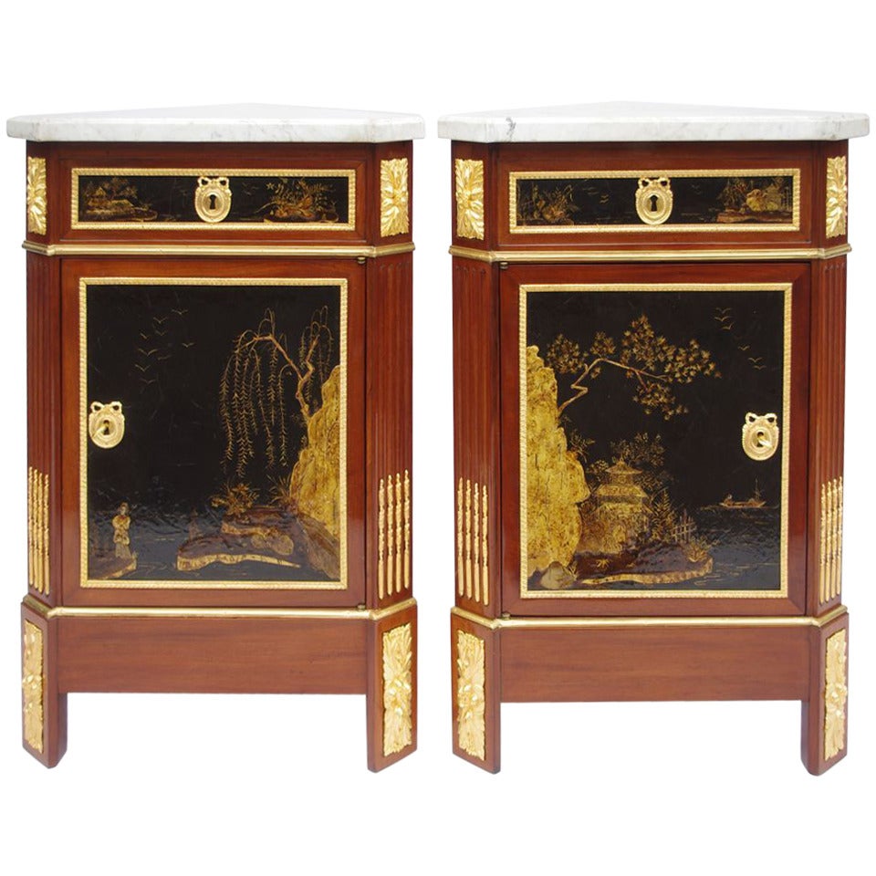1900. Pair of lacquered Louis XVI style corner cupboards in mahogany