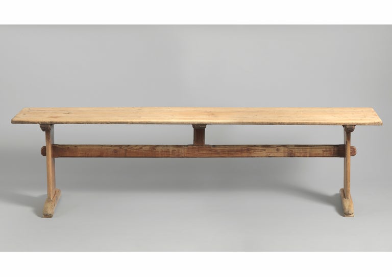 White Pine with Traces of Original Painted Surface
Swedish, c.1850
28 ¼” high x 106 ¾” long x 21 ¼” deep  
A rare and wonderfully understated console in the Gustavian tradition. This scrub top trestle table has traces of original paint to the