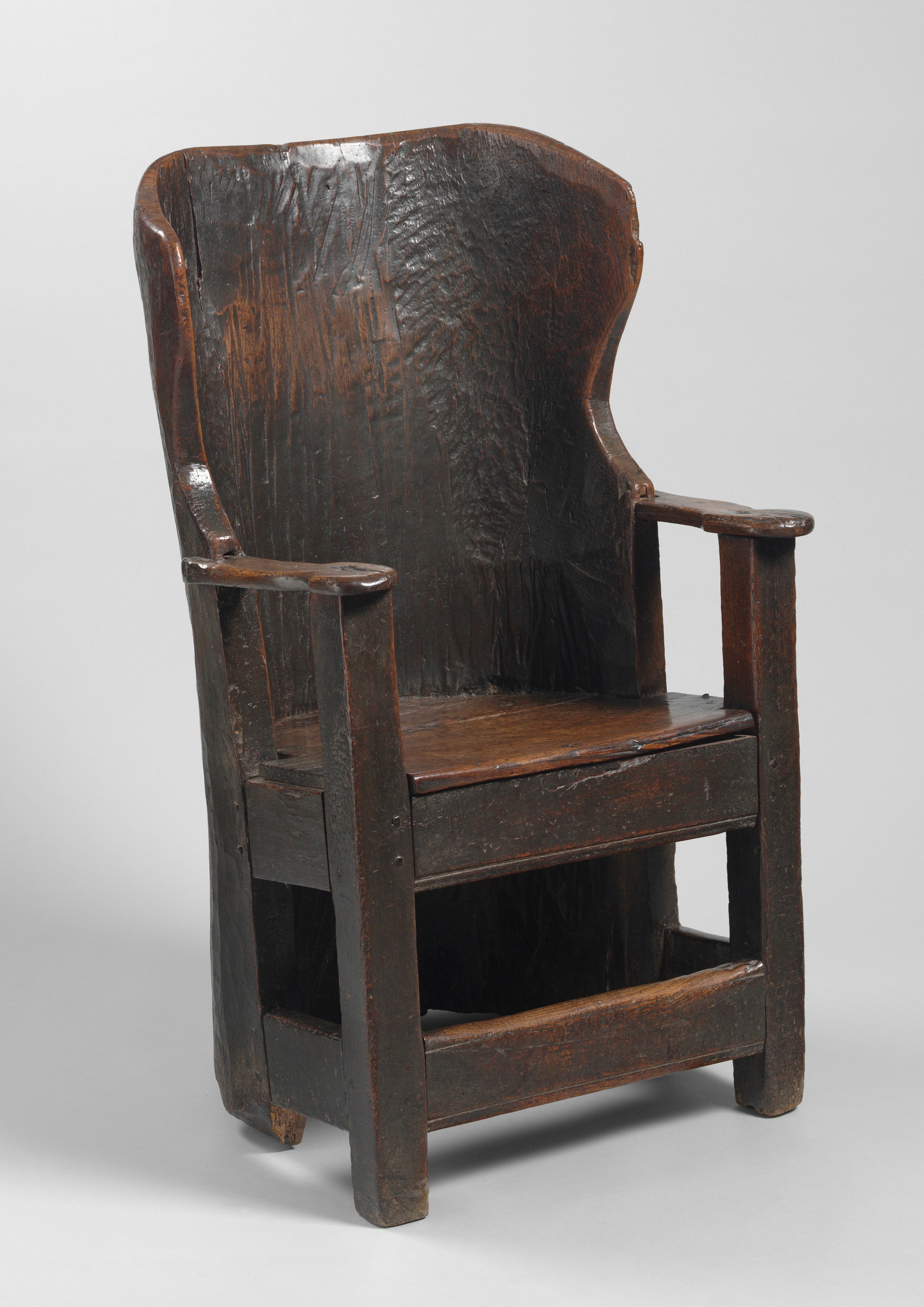 A Fine and Rare Early Dug Out Primitive Wing Armchair