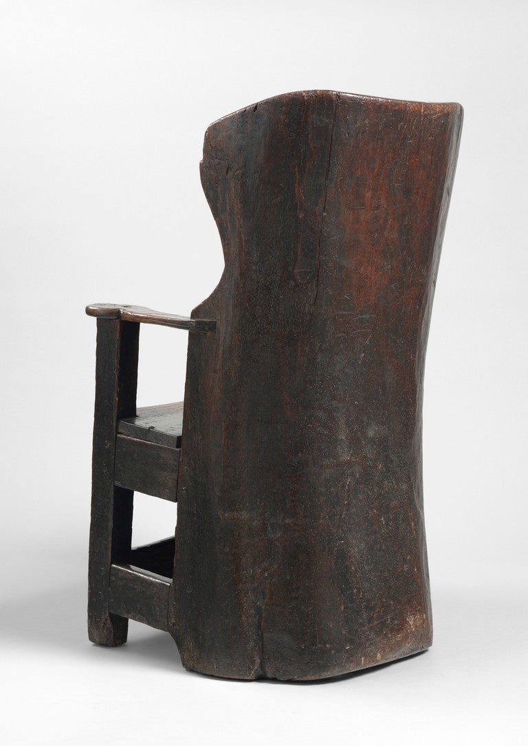 English A Fine and Rare Early Dug Out Primitive Wing Armchair