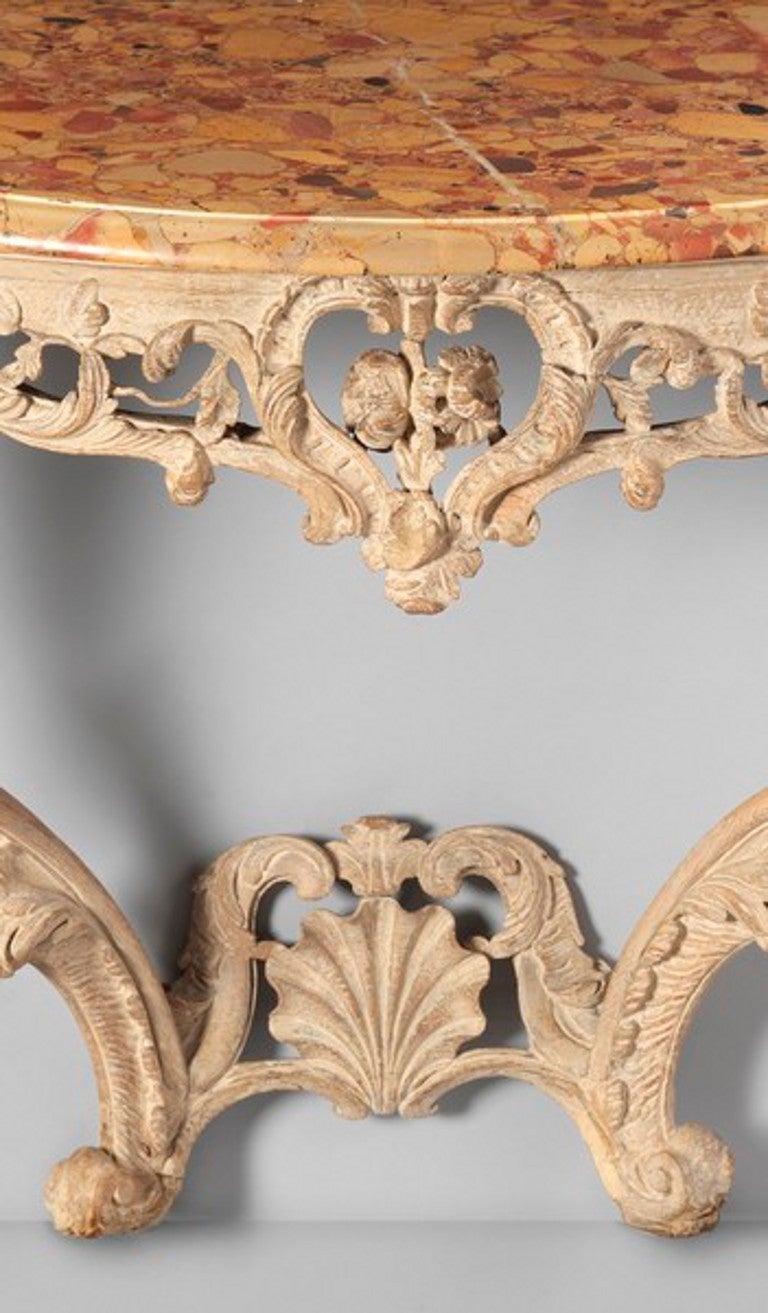 Solid Carved Oak with Traces of Original Paint
Having a Moulded Serpentine Shaped Breccia Marble Top
31” high x 43.25” wide x 18” deep
Provenance: The Marquess of Tweeddale, Yester House, Gifford, East Lothian.

An appealingly elegant and