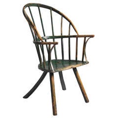 An Exceptional Early Primitive Sack Back Windsor Armchair