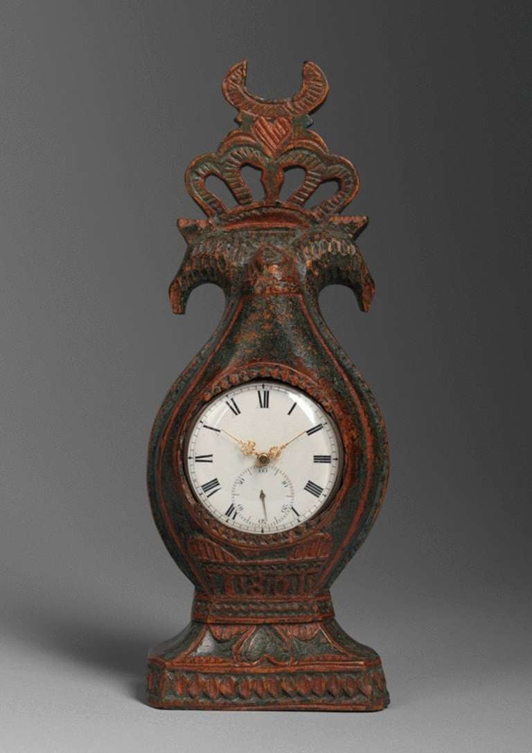 Hand Carved and Painted Birch Wood 
Dated '1801' 
Scandinavian

A very good early Gustavian period example from the Scandinavian Folk Art Tradition, this delightful hand carved Love Token Watch stand is decorated with stylised chip carving