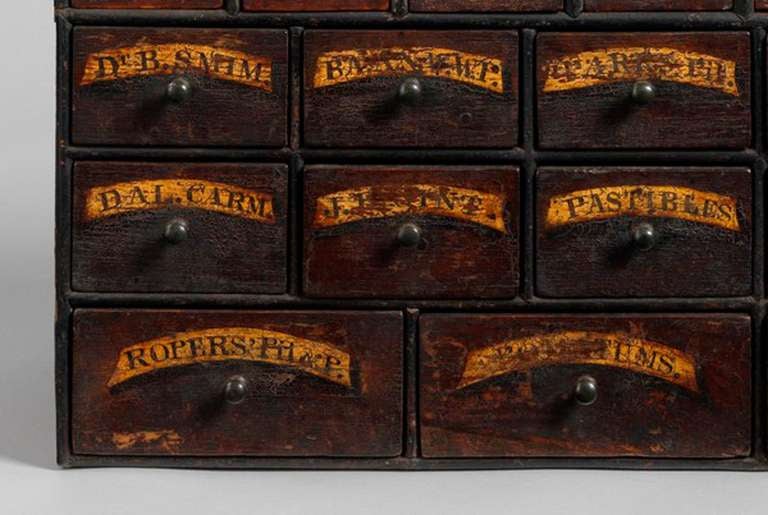 Retaining Original Hand Painted Labels and Handles
Painted and Richly Patinated Wood with Original Handles

Unusually small in scale, this delightful nest of Apothecary's Drawers are in fantastic original condition, retaining the original hand