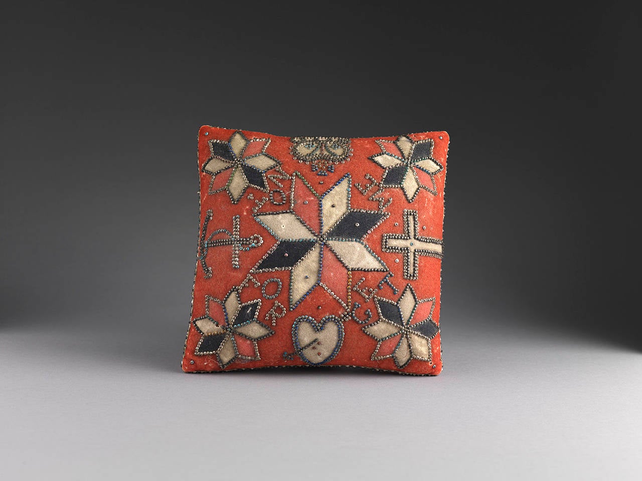 Decorated with Stylised Motifs Including Heart, 
Anchor,Cross and Crown and the Motto 