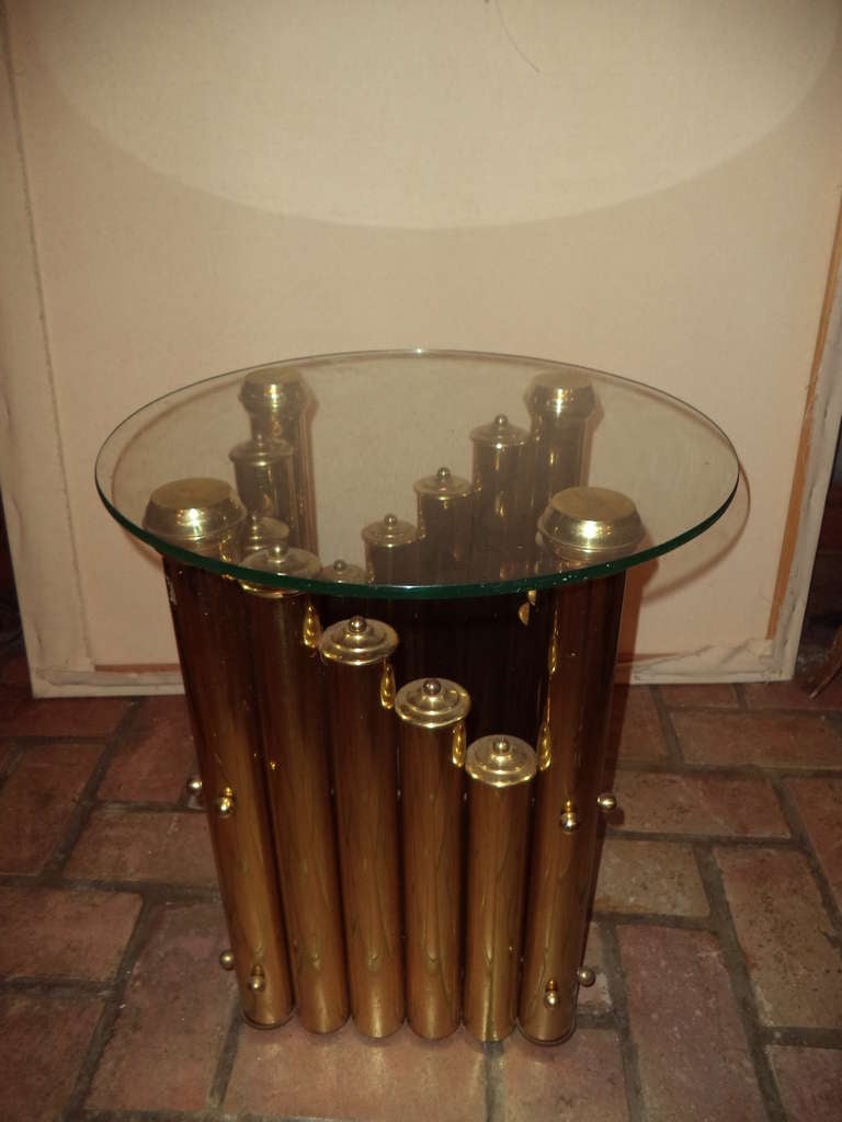 These sculptural modernist tubular brass and glass tables are like functional sculptures. They would also fit in with any Hollywood Regency Decor. Reminiscent of Karl Springers style.