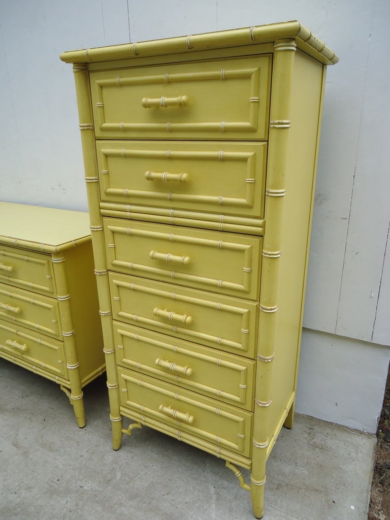 This Hollywood Regency Chinoiserie Faux Bamboo Dresser has 6 drawers and features a white faux bamboo trim with Chinese Chippendale trim brackets at the base.It is stamped inside 