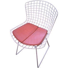 White Bertoia Chair With Orange Cushion