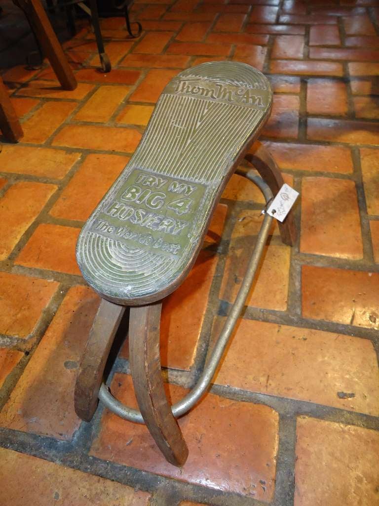 Thom McAn antique foot rest. Used in stores to tie and try on shoes. Great collector piece of Industrial Folk / Advertising Art. Says on foot rest 