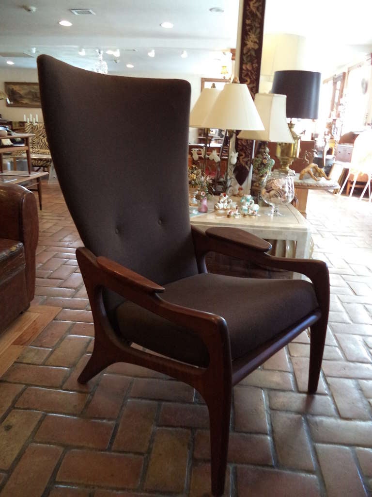 Adrian Pearsall for craft associates sculptural wing back lounge chair in walnut. This amazing chair has it's original brown wool upholstery. The photos make it appear gray but it is a chocolate brown. This high wing back has two buttons on its back