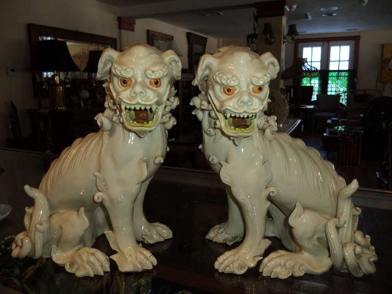 Pair of exceptional 19th century porcelain foo dogs. Amazing attention to detail with it's curly locks of hair and piercing eyes. Stunning one of a kind item. $45 to ship 1stdibs parcel this includes professional packaging.