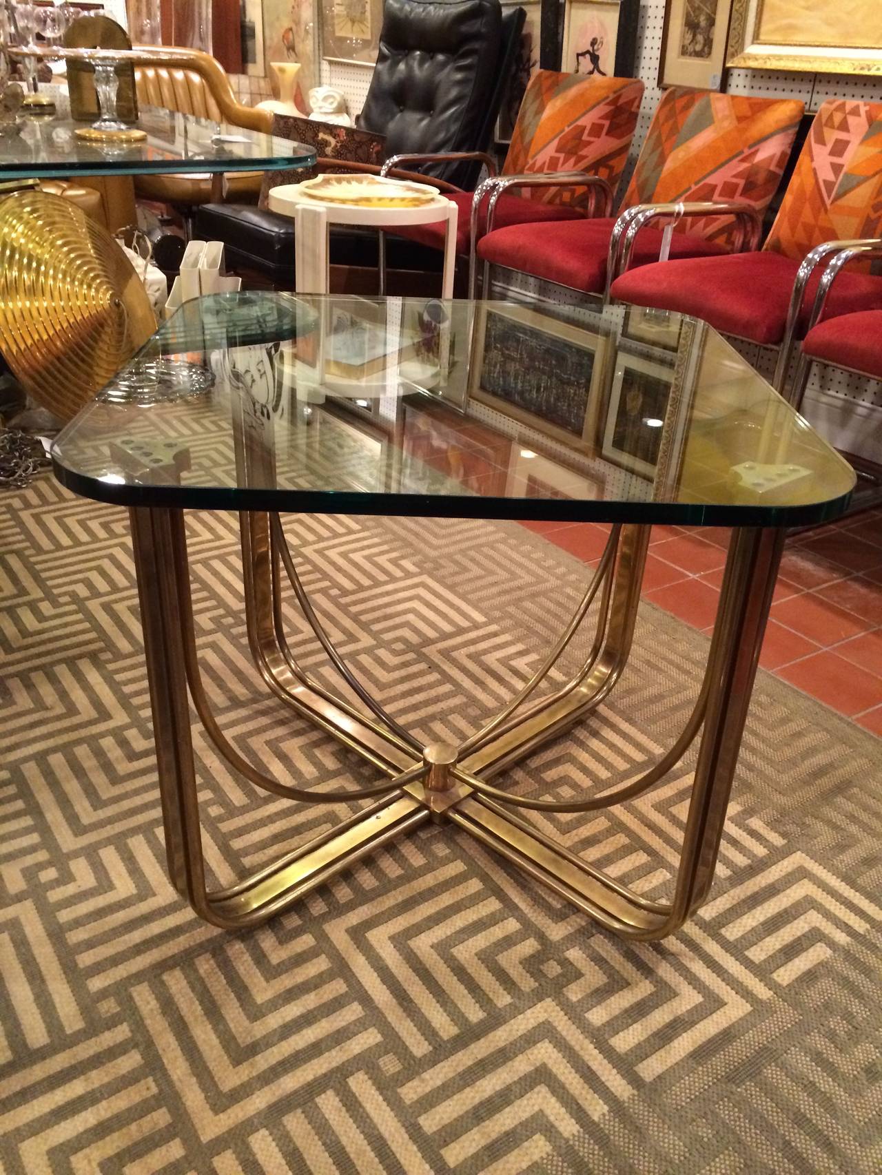 Hollywood Regency Solid Brass and Glass Table. This table would also go with   Industrial style furniture. Attributed to Mastercraft.