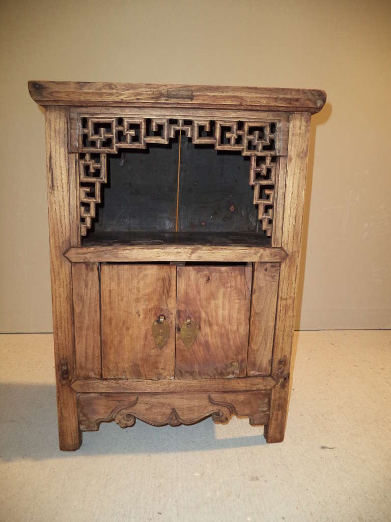 Asian cabinet with fretwork. Chinese Chippendale meets folk. Primitive yet detailed. Great in a bathroom or as a narrow nightstand.