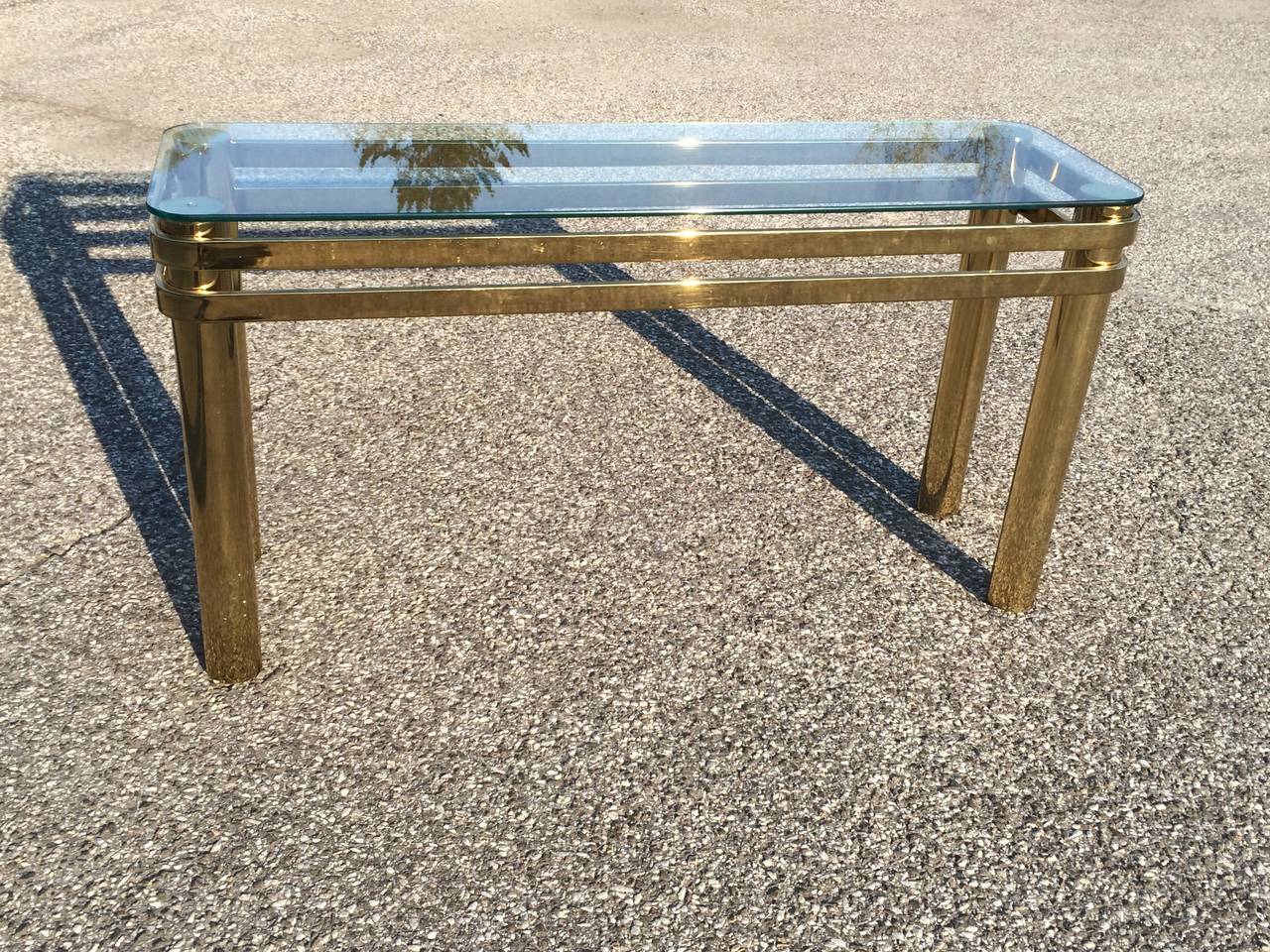 Hollywood Regency brass console or sofa table. Thick double banded tubular brass makes up this table. Matching side and coffee table available if you like matching sets.