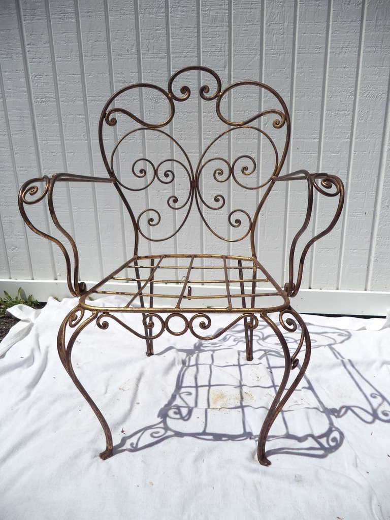 Gilt Iron Arm chair. Great for in or outdoor use. Metal tag Made in Spain.