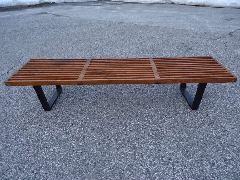 Iconic Mid Century Style. Ideal as a coffee table in front of a long Mid Century Sofa. Too long a span to be used as a bench.