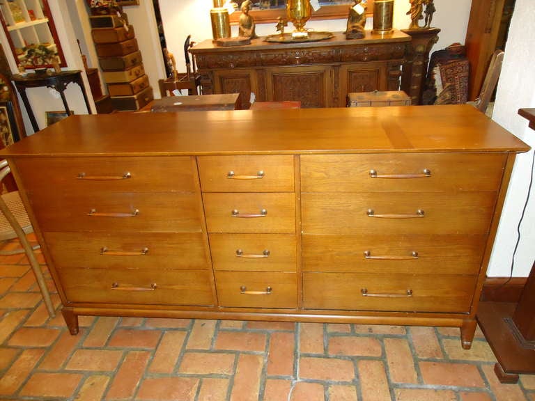 This Henredon Heritage 12 drawer dresser has classic mid century lines and ample storage. It features