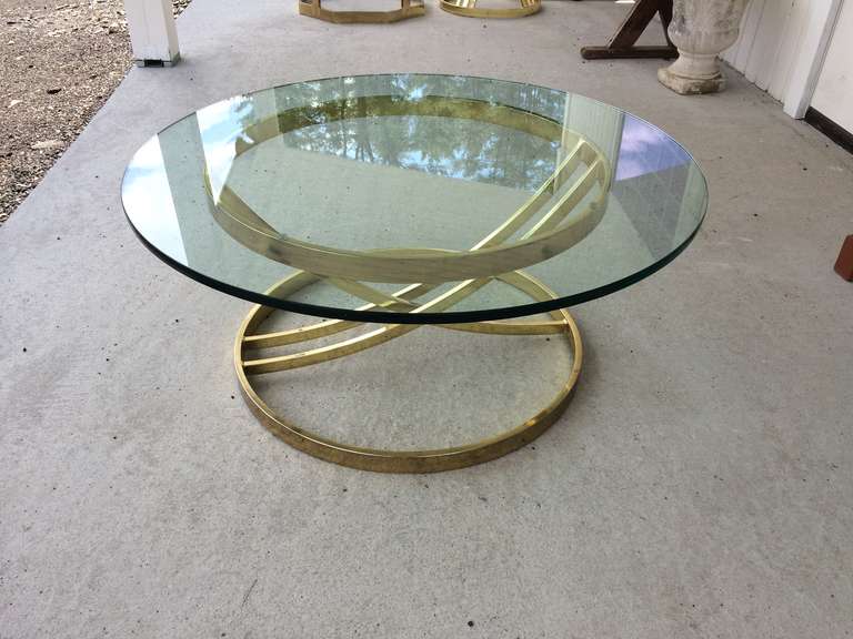 Milo Baughman Round Brass Table with glass top. The glass top has an inch bevel which does not show in the photos.We can cut to order any size.