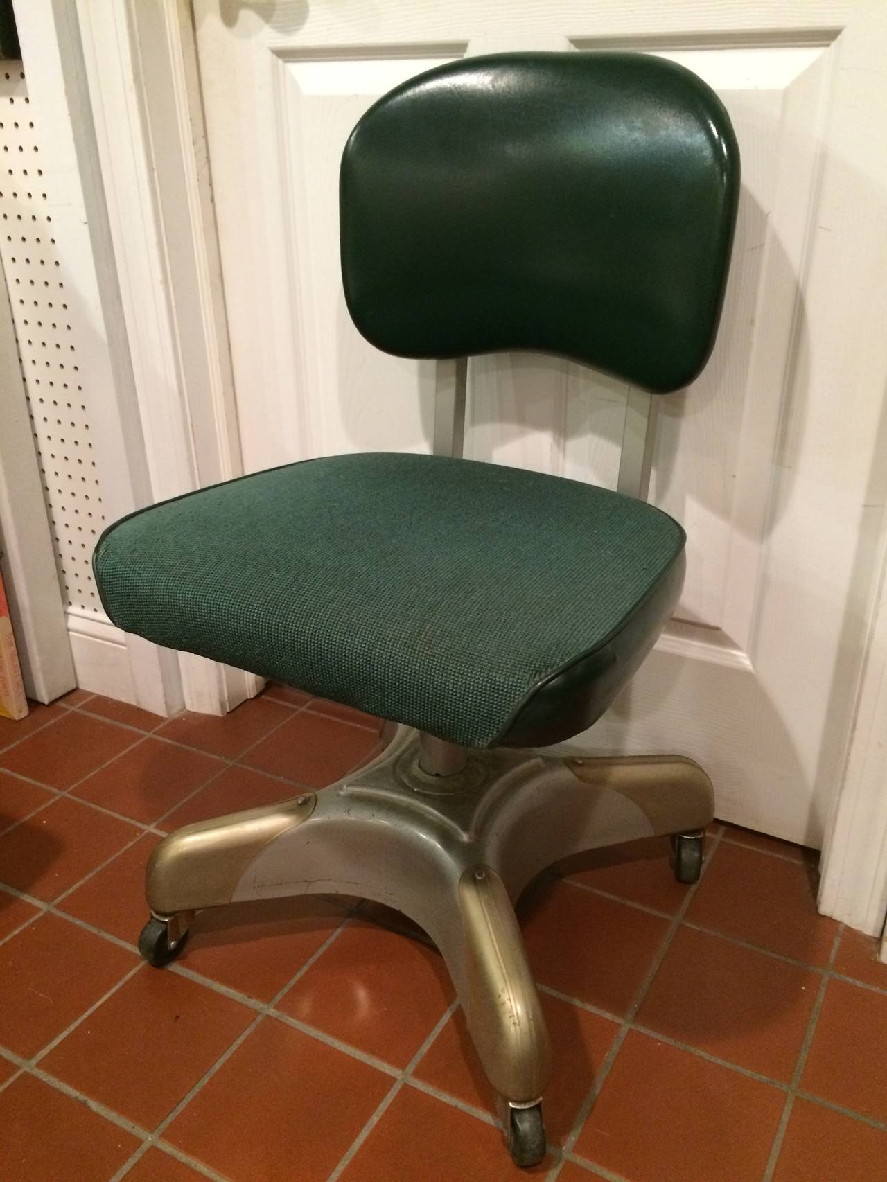 Industrial Office Task Swivel Chair. Heavy and Solid this tank chair epitomizes the 1950's industrial era. Its swivels and adjusts to be ergonomically correct for your body.