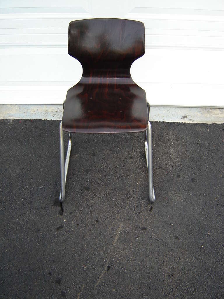 Rare Elmar Flototto Rosewood Side Chair. This bentwood chair is stamped and signed on the chair by Elmar Flototto and has a beautiful rosewood grain. Great as an accompaniment to any Mid-Century desk. This chair can easily be parcel shipped for $95