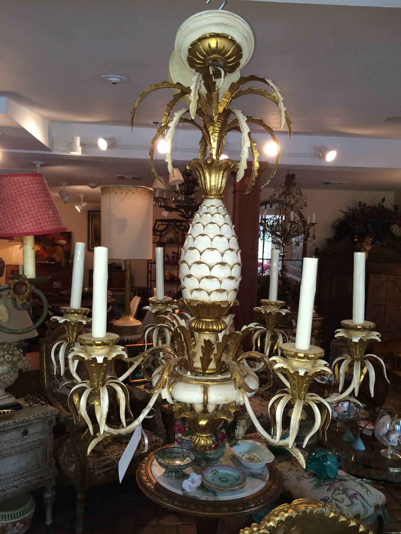 Hollywood Regency carved pineapple chandelier. Wooden hand-carved and gilded with iron.