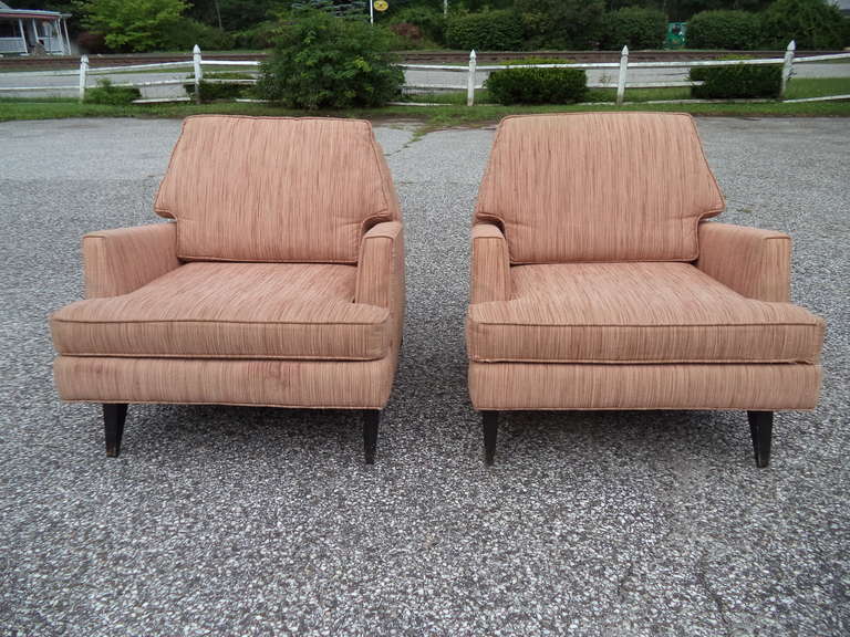 Pair of Sculptural Mid Century Lounge Chairs . Original Upholstery.  Excellent shape and strong solid piece of furniture. In the style of Edward Wormley for Dunbar or Adrian Pearsall.