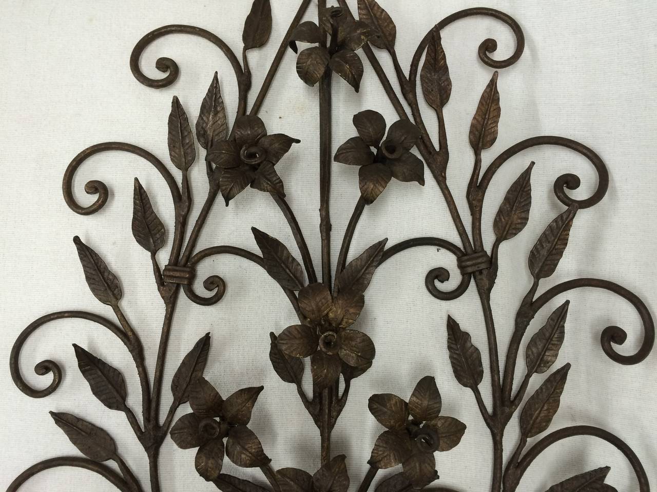 Pair of hand-wrought iron floral wall sconces. Magnificent sculptural pieces. 
Easy to hang and can easily be electrified if desired.
 These should parcel ship for $69 via parcel.
