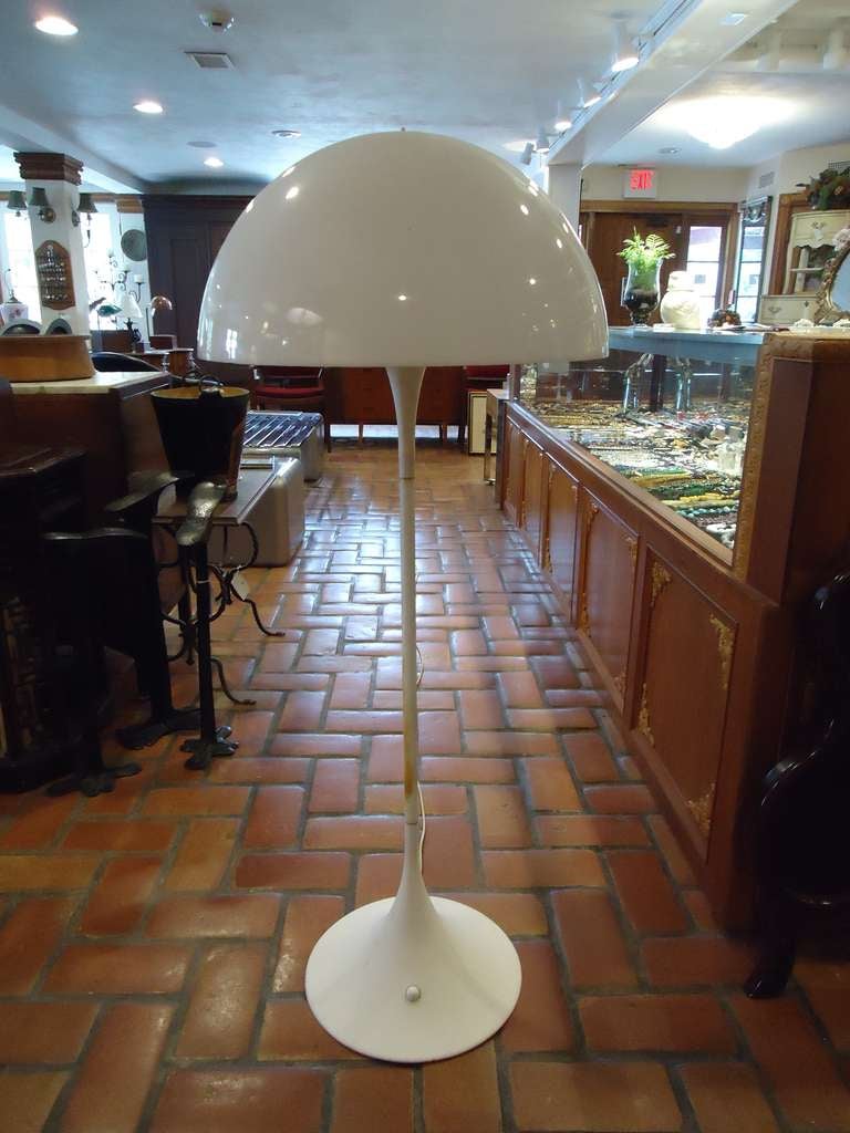 This Classic tulip floor lamp with its mushroom shade is iconic.
This is an original signed Mid-Century piece not a reproduction.