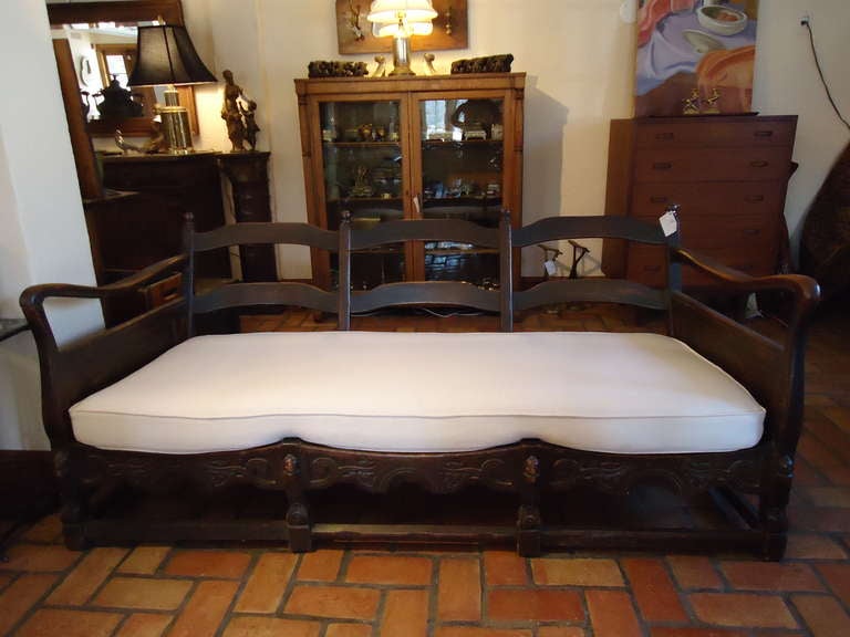 Antique Carved oak Sofa/Daybed  is truly comfortable enough to sleep in. With it's newly upholstered woven duck cloth cushion it would fit into any decor.