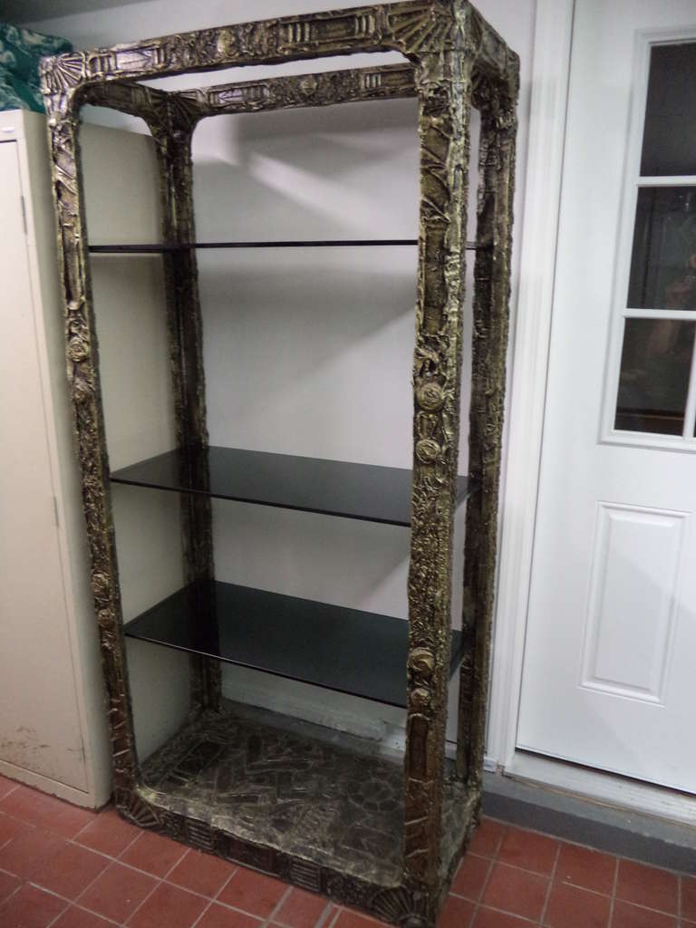 Adrian Pearsall Etagere for Craft Associates.  Designed in the manner of Paul Evans, the sides are a sculpted bronze resin over wood. Three smoked glass shelves make up this piece . Matching sofa , pair of nightstands and coffee table are also