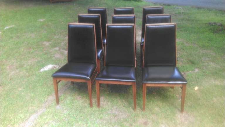 Set of 9 Mid Century Modern Dining Chairs by Dillingham. Will sell just 8 if 9th chair not needed.
Classic solid walnut with black vinyl. Elegant and comfortable.