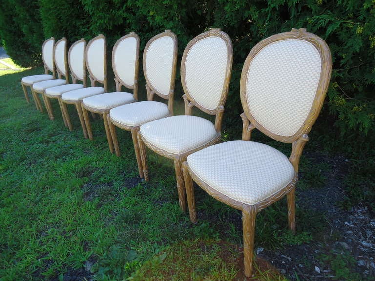 Set of eight Mid century Faux Bois , Louis the XVI style, upholstered dining chairs. Exquisitely carved and in a muted fabric to go with any decor. Will break up set if desired.
