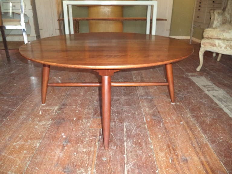 Round Mid Century Coffee Table. Very similar to the Lane Furniture Company productions designed by Andre Bus.
No signature though. Solid wood. No veneers.