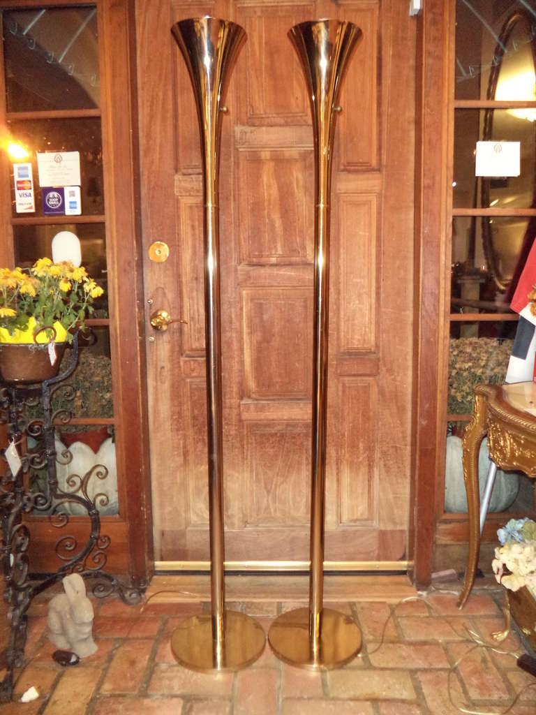Pair of Brass Torchiere Floor Lamps by Laurel Lamp Company. Classic sophistication to illuminate any room.
65.50 H, 7.50 Diam for top 11 Diam for the base. Foot pedal switches turn on/off plus dimmer dials to create different levels of