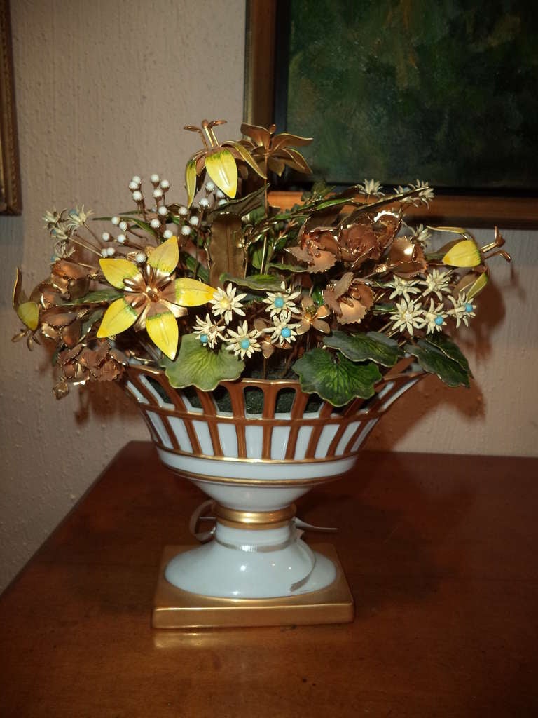 Elaborately  jeweled and enameled floral bouquet in a porcelain vase. Signed underneath.
